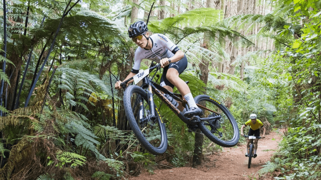 bike jumping over hill