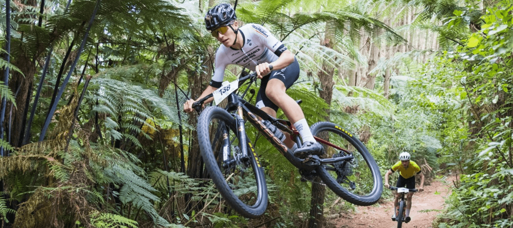 bike jumping over hill